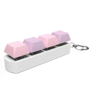 Mechanical keyboard fidget keychain with 4 pink and purple keys on a white base