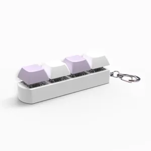 Detail view of 4-key mechanical switch keychain with purple and white caps on white base.