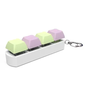Detailed side view of 4-key mechanical keyboard fidget keychain in pastel purple and green