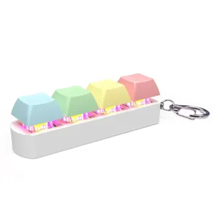 Detailed close-up of a 4-key mechanical keyboard fidget keychain with RGB lighting effects