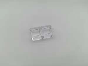 Close-up macro view of a transparent dual-slot mechanical keyboard switch tester base frame