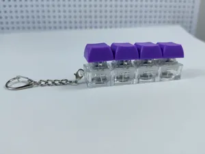 Four-key mechanical keyboard switch fidget keychain with purple keycaps and LED light.