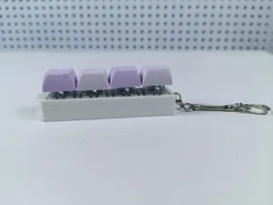Purple 4-key mechanical switch fidget toy keychain with white base detail