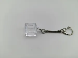 Detailed view of a transparent mechanical keyboard switch tester base keychain frame