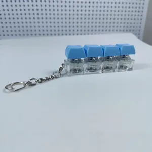 4-key mechanical keyboard switch fidget toy keychain, stress relief blue keycap pendant.