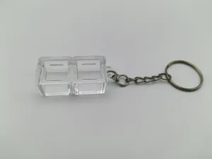 Detailed view of transparent dual-socket mechanical keyboard switch tester keychain