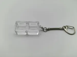 Close-up of clear mechanical keyboard switch tester keychain base with two slots