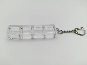 Clear acrylic 4-slot mechanical switch tester base with a durable metal keychain link