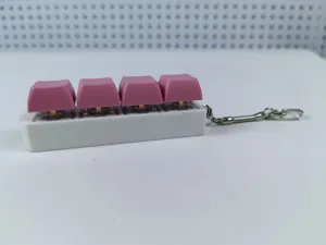Stress-relieving 4-key mechanical keyboard switch tester keychain with pink keycaps