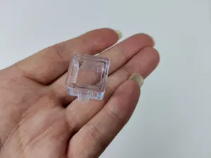 Detailed macro view of a clear transparent plastic base for mechanical keyboard switch tester tool
