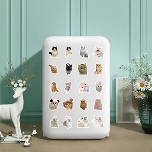 Set of realistic cat stickers displayed on a white surface in a cozy room setting