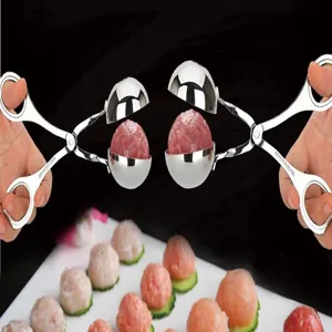 Stainless steel meatball maker spoon tong in action, showing easy meatball shaping process.