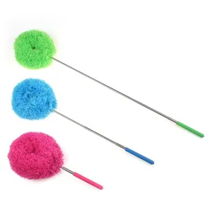 Telescopic microfiber duster for household cleaning with colorful fluffy heads and long handle.