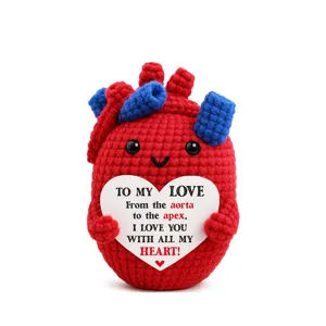 Mini crochet anatomical heart plush doll detail view, cute romantic gift ornament for couples.