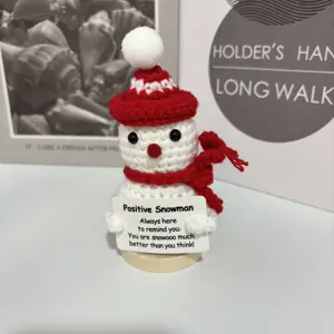 Handmade crochet positive snowman toy with red hat and scarf, cute desk decor gift.