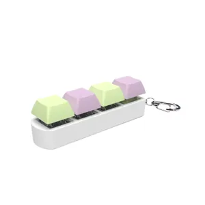 Fidget mechanical keyboard switch keychain with four pastel colored light-up keycaps