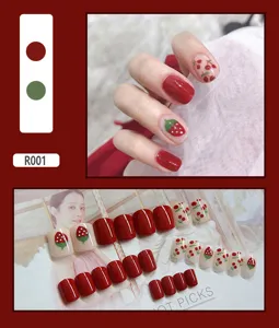 Detailed view of 24pcs red and nude press-on nails with cute strawberry and cherry patterns