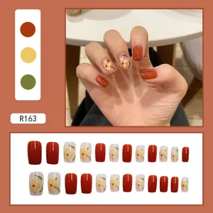 Autumnal square press-on nails set with brown finish and white floral pattern accents