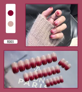 Elegant red to nude gradient press-on nails with gold glitter accents, style R003.