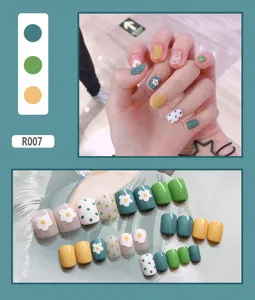 Detailed macro view showing a full set of 24 cute daisy and polka dot press-on nails