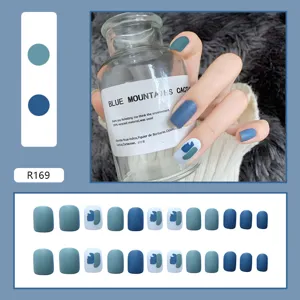 Matte blue press-on nails with abstract color block design, short round shape set for women