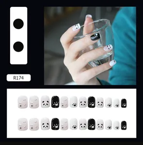 Detailed layout of cute panda and paw print press-on nails in black and white finish