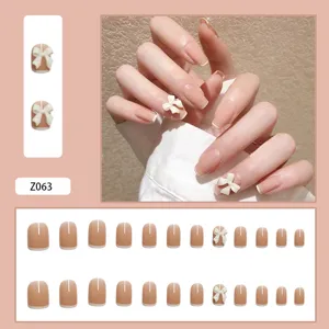 Nude-farbene Kunstnägel Set mit 3D weißen Schleifen und French-Tips Dekor
