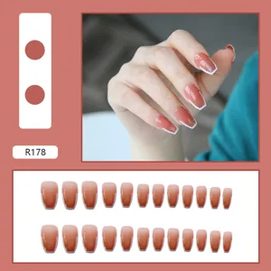 High-gloss terracotta gradient press-on nails featuring elegant white French tips design