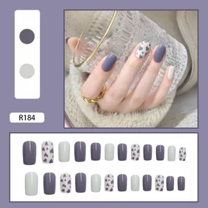 Detailed view of 24pcs purple press-on nails set with heart patterns and solid colors.