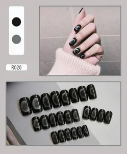 Close-up detail of 24pcs black press-on nails featuring realistic moon phase designs
