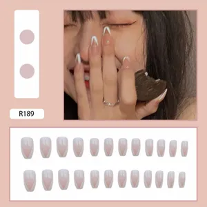 Elegant French V-tip press-on nails set in nude pink and white, long stiletto shape design.
