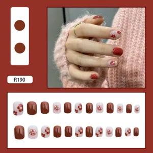 Detailed view of elegant red and floral patterned press-on nails set with SKU R190