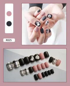 Detailed view of 24pcs cute Snoopy press-on nails set in matte black and dusty pink