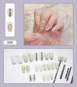 Ensemble d'ongles à presser blancs élégants avec paillettes dorées et strass