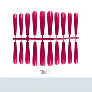 Detailed view of professional magenta extra long coffin press-on nails set on a plastic frame