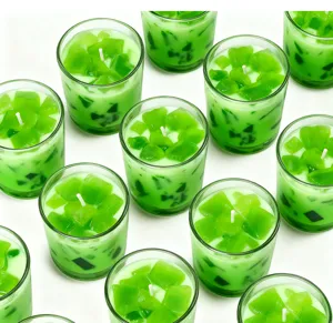 Green jelly scented candle in glass cup, soybean wax home fragrance set for relaxation.