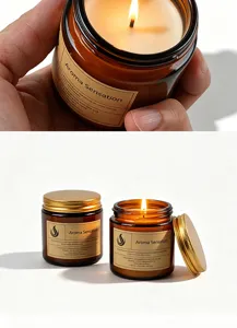 Close-up detail of amber glass scented candle with golden lid and vintage label design.