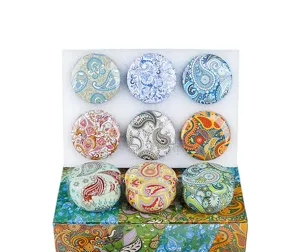 Decorative scented candle tin jars set with vintage paisley floral patterns for gifts.