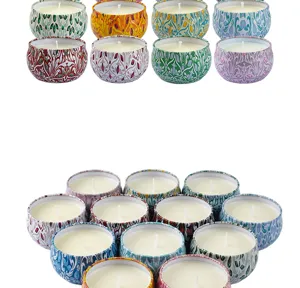 Set of 12 decorative scented candles in colorful patterned metal tins for home decor