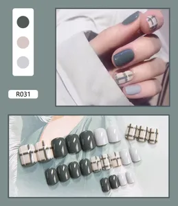 Macro view of 24pcs cute plaid and solid gray removable press-on nail tips set.