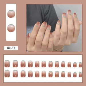 Detailed display of R623 wearable press-on nails set featuring brown gradient and green tips