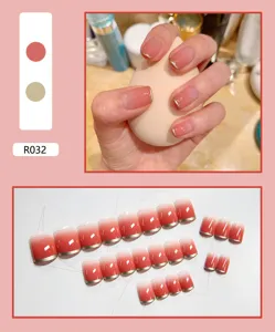 Set of 24 pink gradient press-on nails featuring elegant gold metallic French tips, R032
