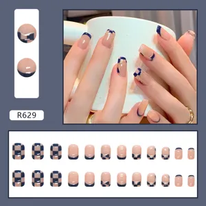 Detailed view of 24pcs set navy blue checkerboard and French tip press-on nails set