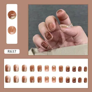 Macro detail of 24pcs amber brown marble press-on nails with gold foil accents