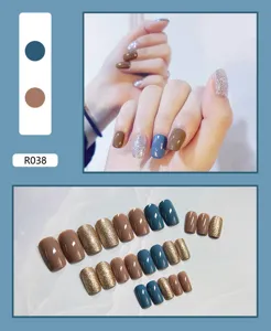 Detailed view of 24pcs wearable press-on nails in blue, brown, and glitter silver