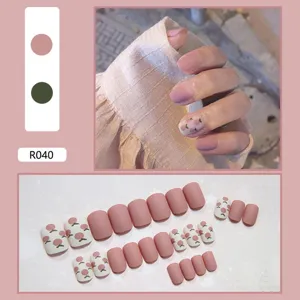 Set of 24 cute pink press-on nails with peach patterns for DIY manicure and fashion