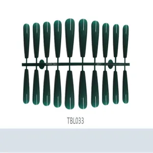 Detailed view of dark green long ballerina press-on nails in bulk strip layout