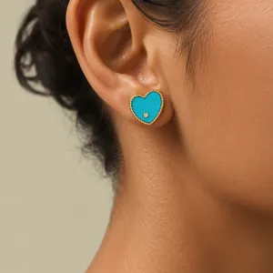 Detailed view of turquoise enamel heart stud earring featuring a gold-plated scalloped edge