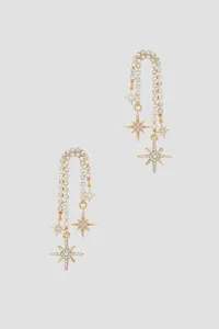 Detailed view of 18K gold plated tassel earrings with zirconia stars