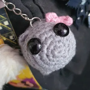 Handcrafted cute sad hamster crochet keychain, grey plush toy bag charm for women.
